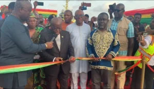 President Akufo-Addo (middle) cutting a tape to inaugurate the oil and gas terminal at the Takoradi Port