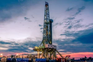 Drilling rigs operate at sunset in Midland