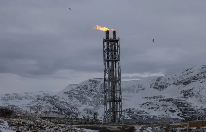 Flames blaze from a chimney, in Hammerfest