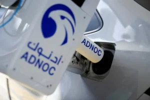 An Abu Dhabi National Oil Company's (ADNOC) robotic fueling arm fuels a car as part of a demonstration during a media tour in Abu Dhabi, United Arab Emirates, May 27, 2024. REUTERS Nabila Eltigi File Photo